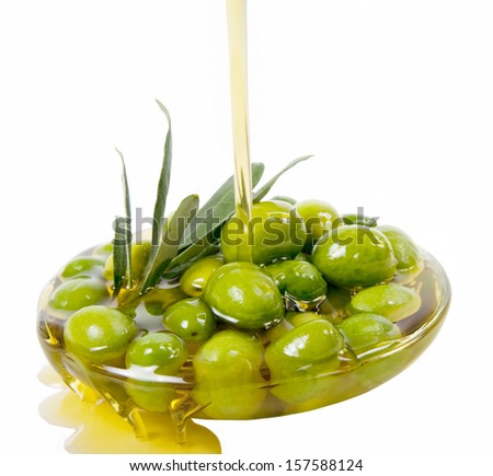 Olive oil and raw olives isolated on white background 