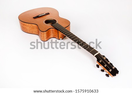 wood texture of lower deck of six strings acoustic guitar on white background. guitar shape