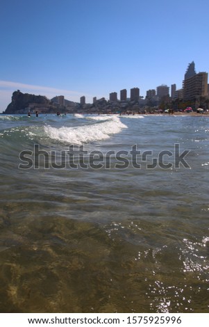 Sea. Waves on the sea. The beach and town. Resort in Spain