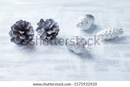 Christmas ornaments on bright wooden background. Close up. Copy space. 