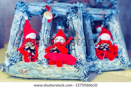Winter Saami Souvenirs at Finnish Christmas Market in Rovaniemi, Finland, Lapland. Stall with traditional Toys. Street Xmas holiday fair. Advent and Stalls with Crafts on Bazaar