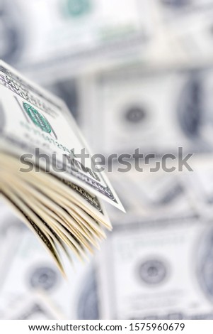 Stack of hundred dollar bills, banknotes of hundred, closeup