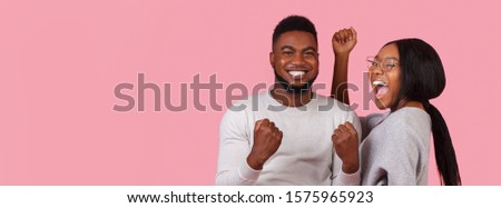 Unbelievable proposition. Emotional man and woman expressing happiness over pink background, panorama with free space