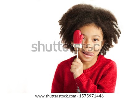 Happy adorable african american child girl celebrates christmas isolated on white background
