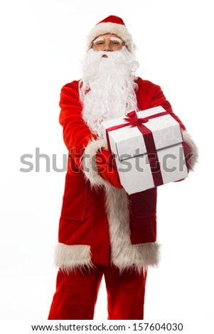 Santa Claus presenting gift box isolated on white background 