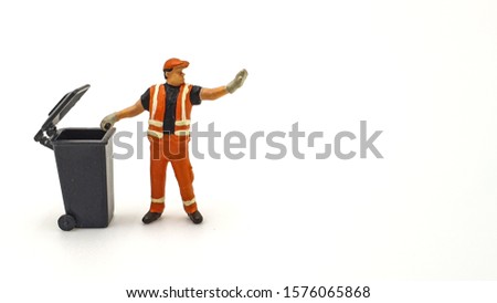 Miniature people Trash keeper on white background 