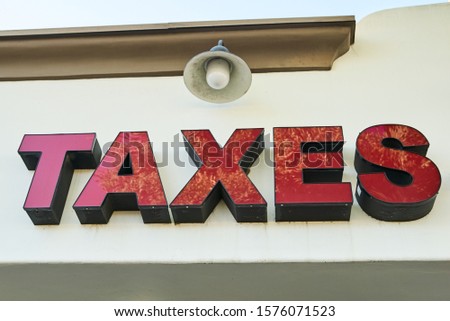 Sign with the word: TAXES