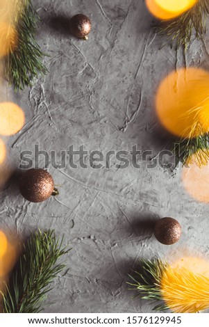 Christmas and New year decorative background border with golden toys on Christmas tree. Flat lay, top view, copy space.