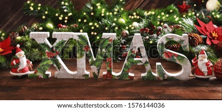 wooden Christmas background with decorative letters XMAS standing in a row