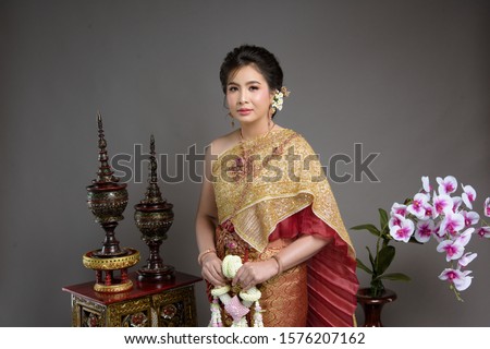 Beautiful Thai woman wearing Thai dress and Thai dance