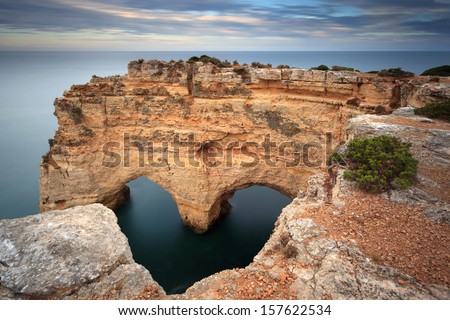 Heart-shaped Rock in the Algarve on the southern coast of Portugal Royalty-Free Stock Photo #157622534