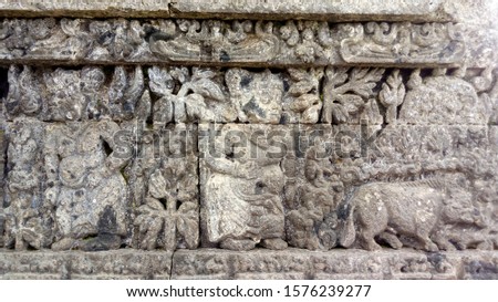 world heritage day concept. the relief of jago temple, nature photo object
