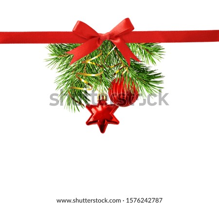 Christmas decorations with pine twigs and silk ribbon bow isolated on white background