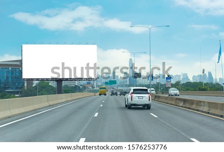Advertising concept, Blank template  for outdoor advertising or blank billboard on the highway in city. With clipping path on screen - can be used for trade shows, promotional poster.