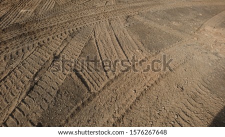 Wheel tread texture on sand with irregular grooves
