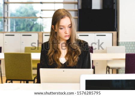 Caucasian woman working in the office
