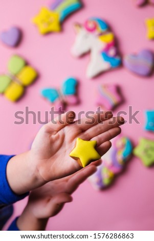 Beautiful, bright, figured gingerbread cookies for the holiday on a pink background