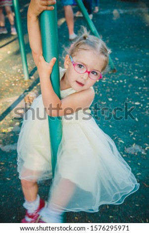 cute girl walking in the Park on holiday in a dress