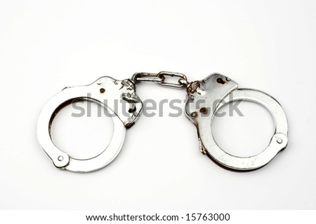 Handcuffs and key isolated on white background