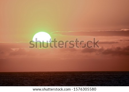 Photo Picture of The Sun Setting in the Sea