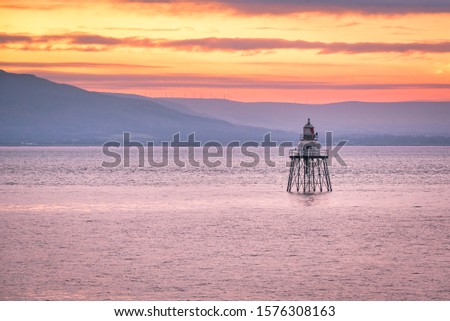 This is a picture of the navigational light just of the coast of Moville in Donegal Ireland, It was taken just as the sun was rising