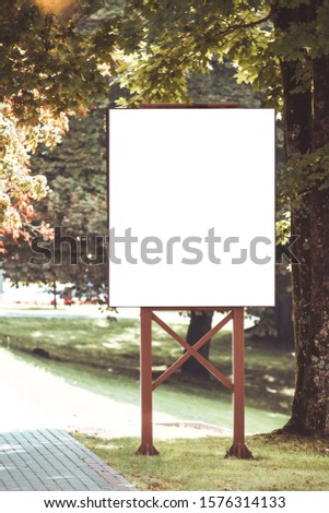 Mock up. Outdoor advertising, blank billboard outdoors, public information board in the park