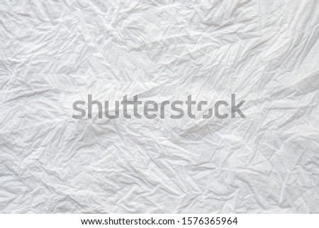 Close-up texture of Crumpled white color tissue paper background abstract. Detail texture of pattern with free space copy for text.
