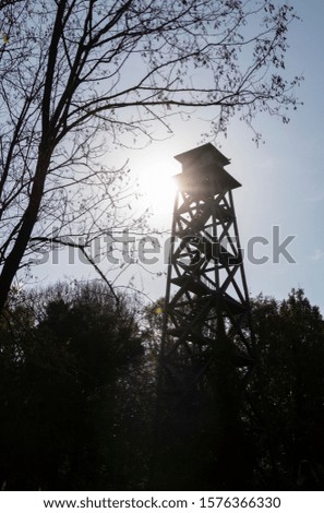 a silhouette of a watchtower