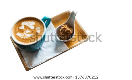 Coffee latte art with swan and hearts pattern. Isolated on white background and clipping path included. Picture is partly focused.