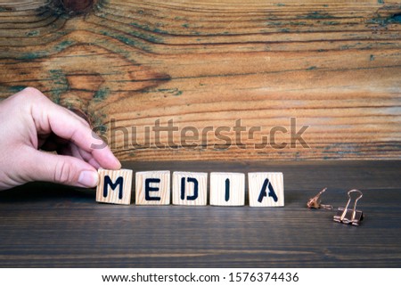 Media. Internet, News, Marketing and Trust concept. Wooden letters on the office desk, information and communication background