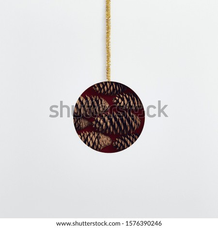 Christmas minimal concept - abstract christmas bauble made of pinecone. Winter holiday symbol. Xmas winter holiday concept. Vintage mockup with shape bauble christmas minimal.