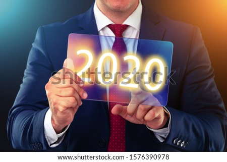 Businessman working with future technology screen, new year 2020 finance concept.