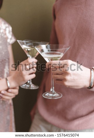 Woman and man holding glass with champagne. Party concept. Engagement couple