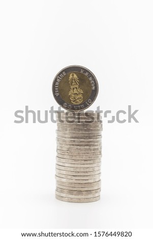 Money, Financial,Saving, Business Growth concept, Closeup of stack of silver coins as bar chart on white table and copy space for text.