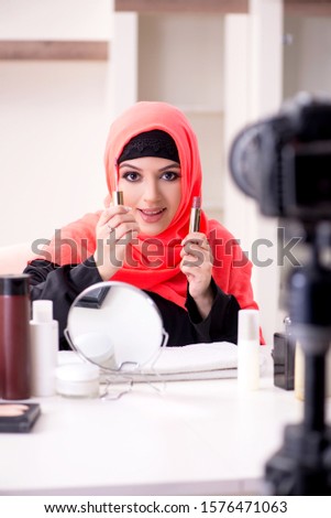 Beauty blogger in hijab recording video for her blog