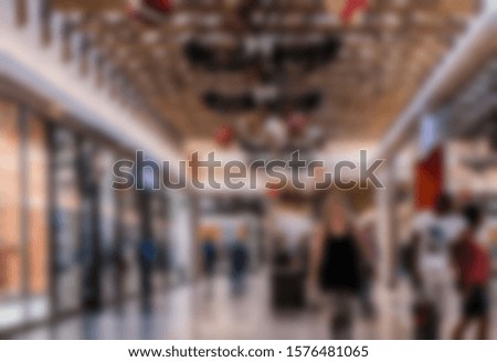 Shopping christmas. . Silhouettes of Business People in Blurred Motion Walking. Business people walking in the office corridor.

