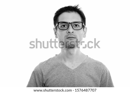Studio shot of young man wearing eyeglasses