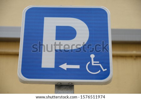 a traffic sign: "Disabled Parking Only", Valencia Province, Spain