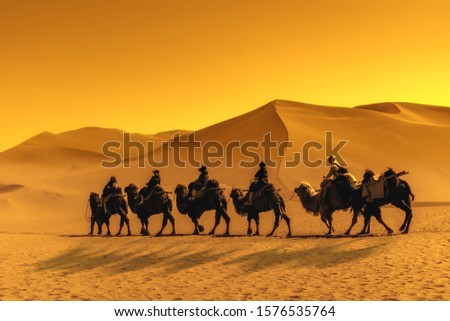 Dunhuang Mingsha mountain camel riding team Royalty-Free Stock Photo #1576535764