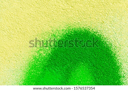 Beautiful bright colorful street art graffiti background. Abstract creative spray drawing fashion colors on the walls of the city. Urban Culture, orange , yellow, green, neon texture