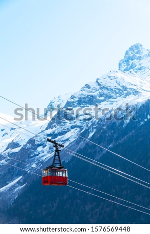 Ski cable car in the winter snow season. blue sky and mountains background.