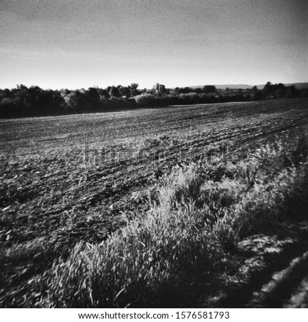 Field is prepared in the spring - This black and white photo is NOT sharp due to camera characteristic. Taken on film with a medium format camera