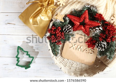 Christmas white background with new year attributes. Star, spruce, cones, text xmas