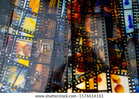 Developed color slide films lie on a light table. For design.