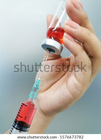 syringe, medical injection in hand, medicine plastic vaccination equipment with needle.Nurse or doctor. liquid drug or narcotic. health care in hospital.