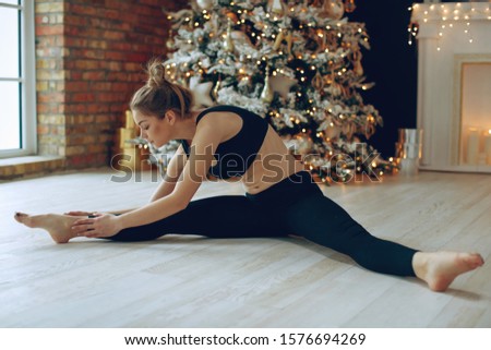 A woman goes in for sports at Christmas. 