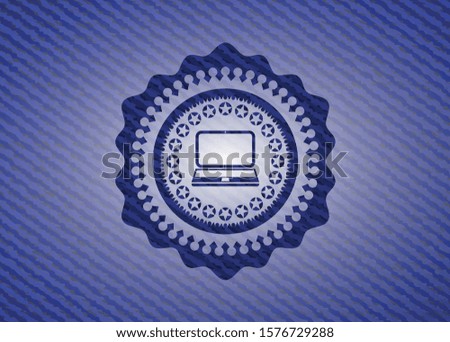 laptop icon inside emblem with jean texture