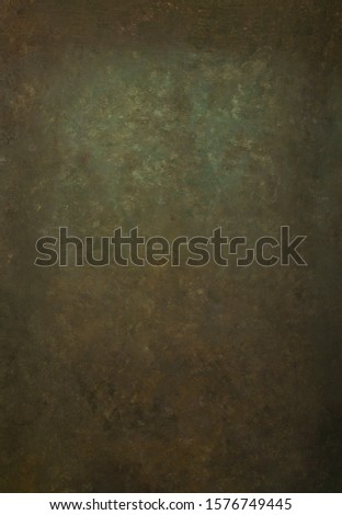 Traditional brown green painted textur muslin or canvas fabric cloth studio background or backdrop