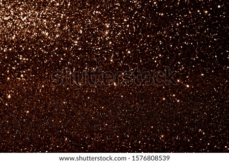 Abstract gold blured sparkling background with focused area. Holiday festive concept.  Glitter confetti.  Christmas lights. 