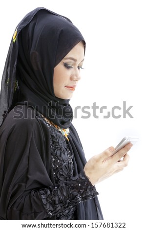 close up portrait of Young beautiful Muslim business woman while calling isolated over white background 